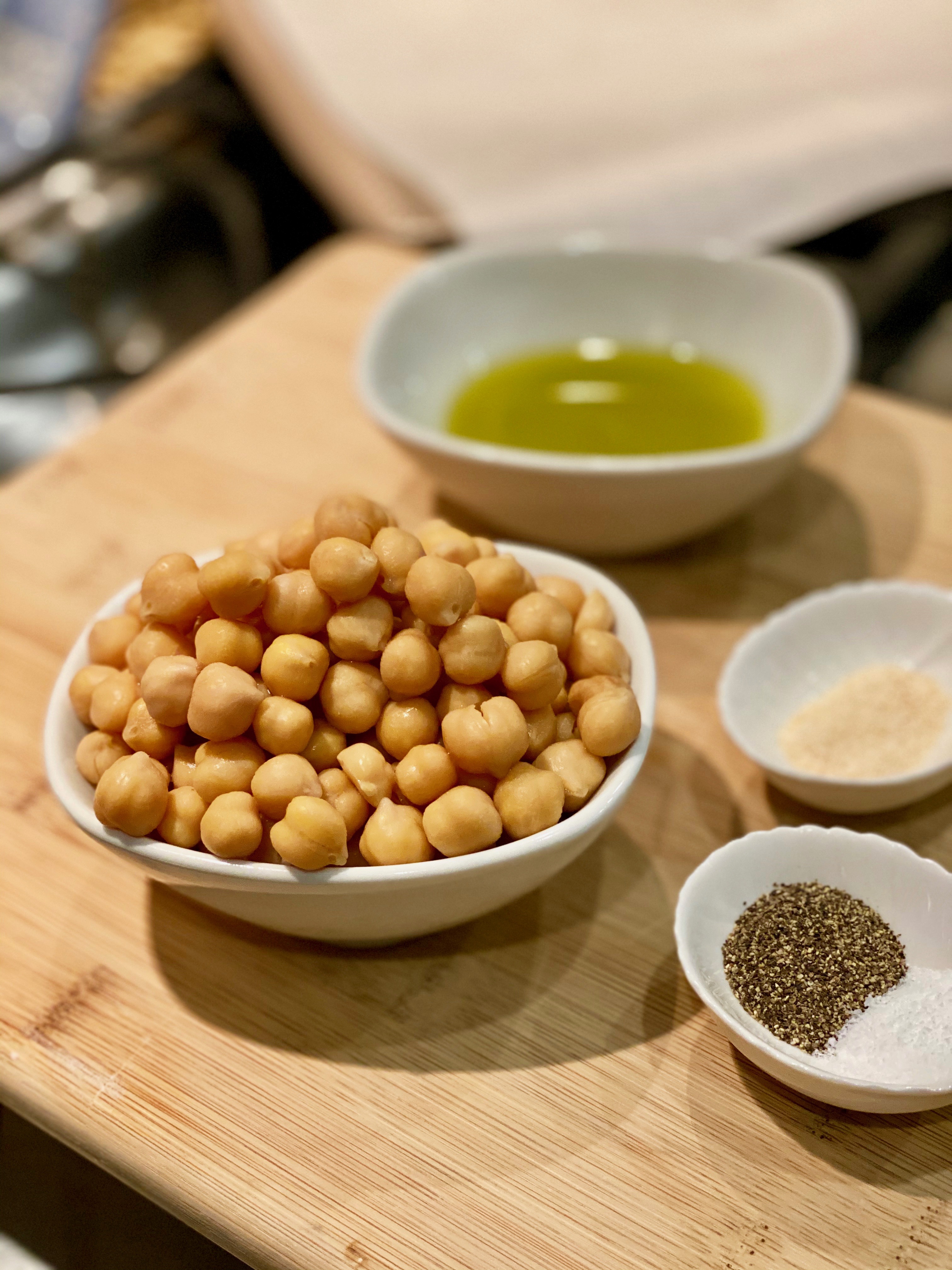 a small pile of chickpeas, olive oil and spices 
