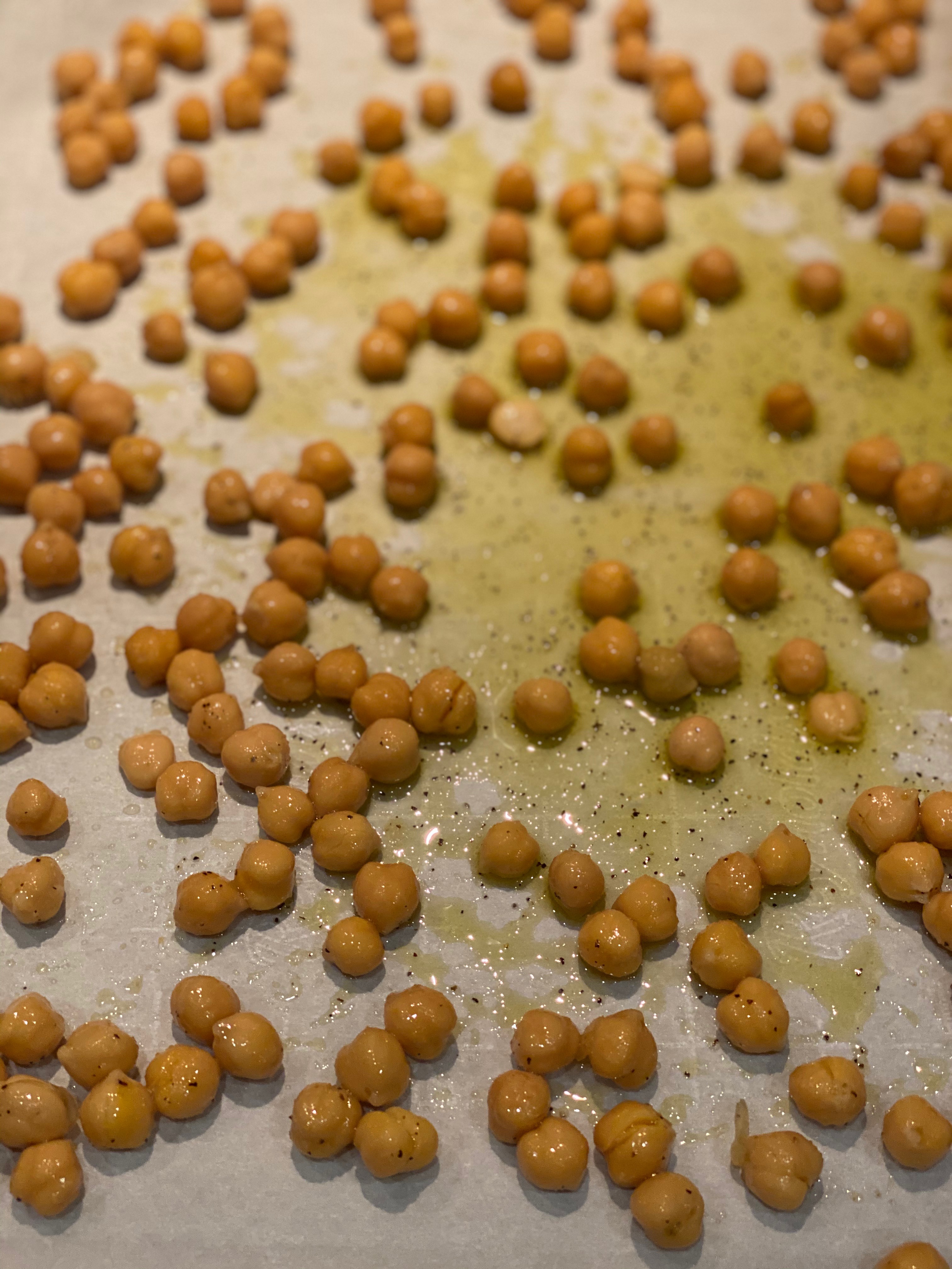 a cookie sheet with roasted chickpeas 