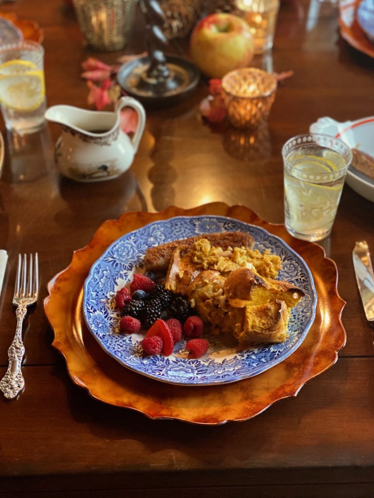 pumpkin french toast with blackberries and raspberries on a blue china plate