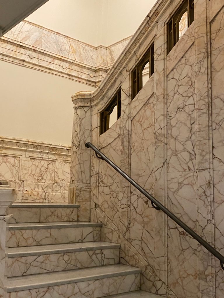 a marble clad staircase at the hotel