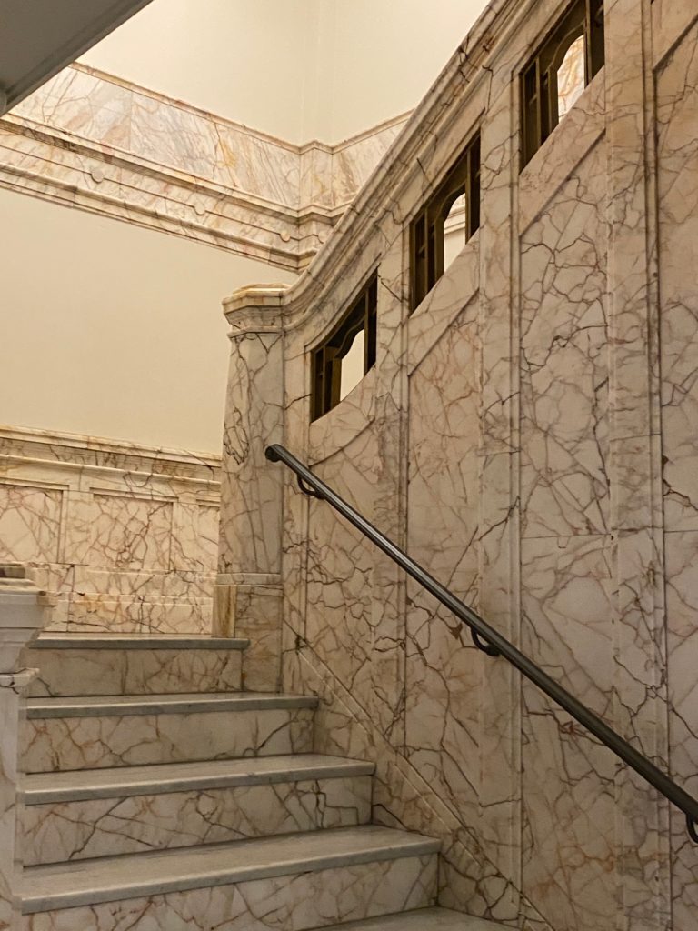 a marble clad staircase at the hotel 