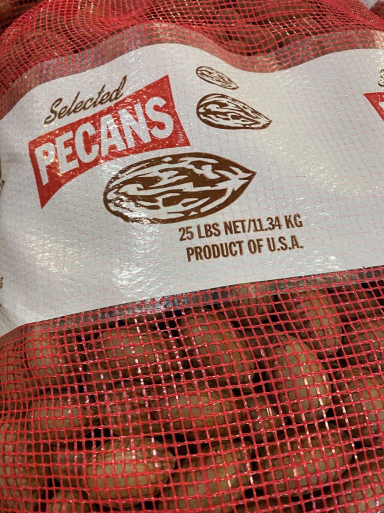a bag of Georgia pecans in a red mesh bag