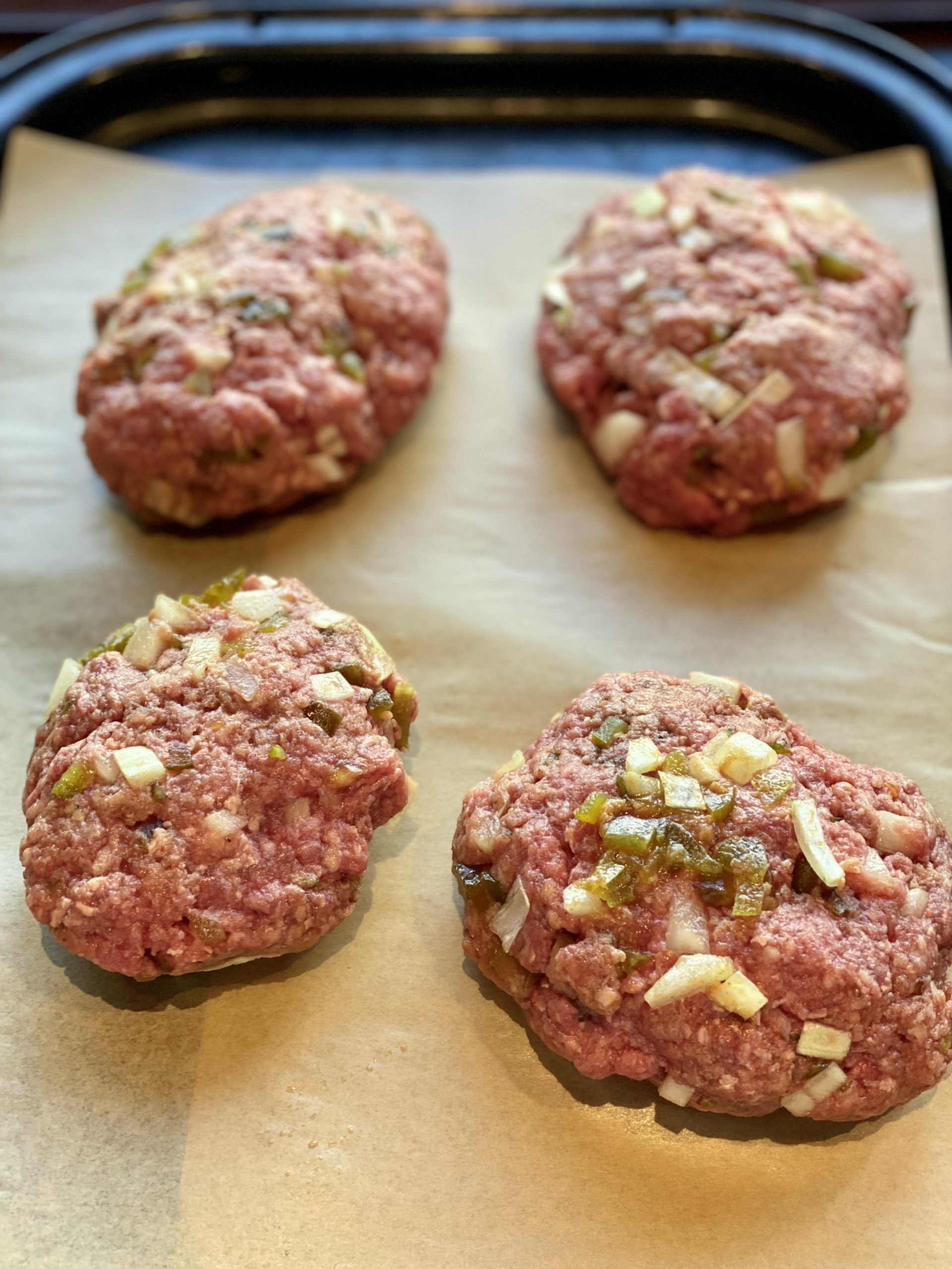 beef patties on a parchment paper