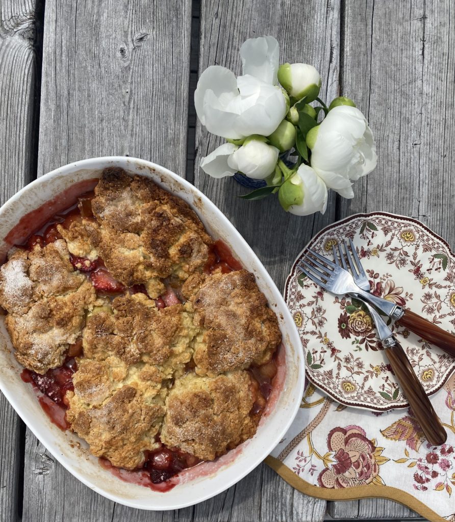 a baking pan filled with a berry cobbler 