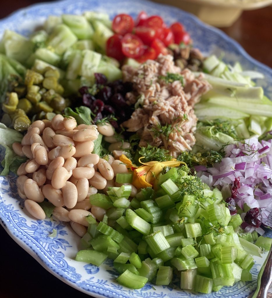 a platter filled with chopped vegetables