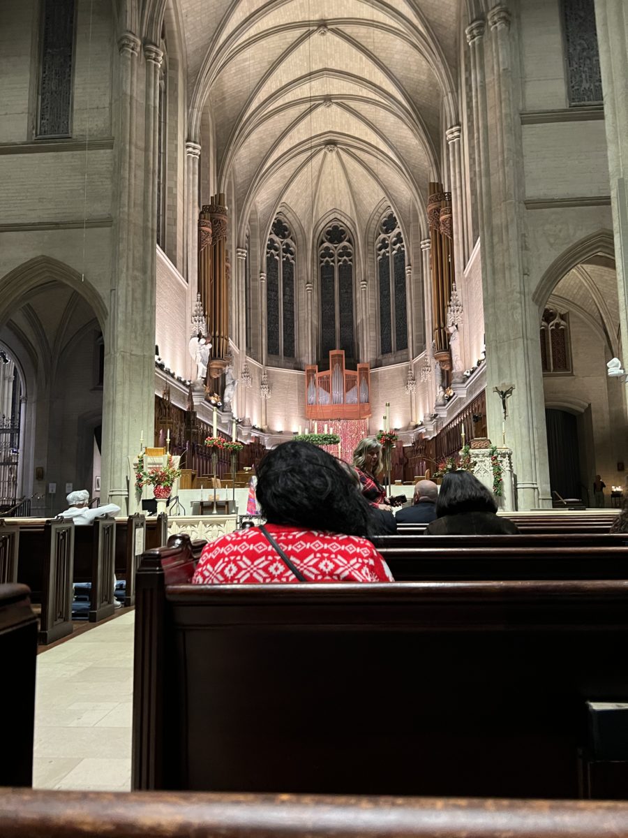 Aparishoner in quiet reflection before the Midnight Service on Christmas Eve at Grace Cathedral