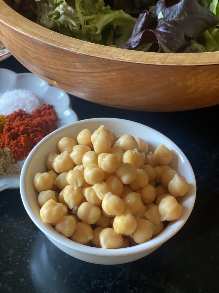 a small white bowl of canned chickpeas 