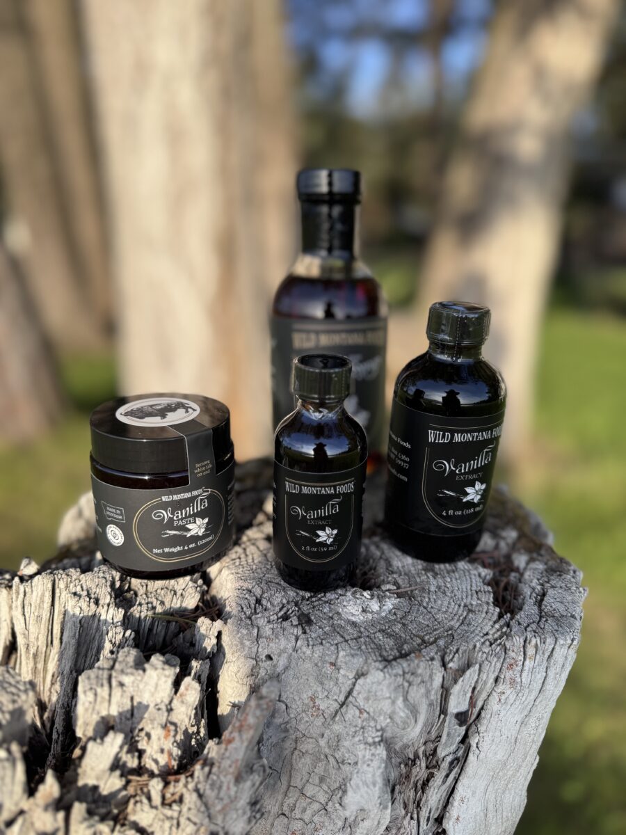 a collection of jars and bottles of vanilla products