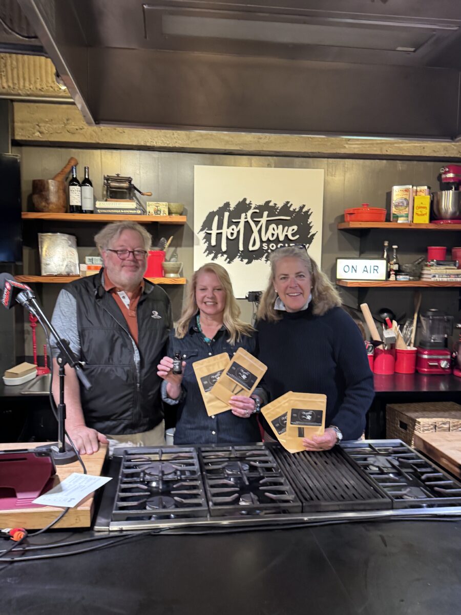 Tom Douglas and Meggen Wilson on set at the Hot Stove Society