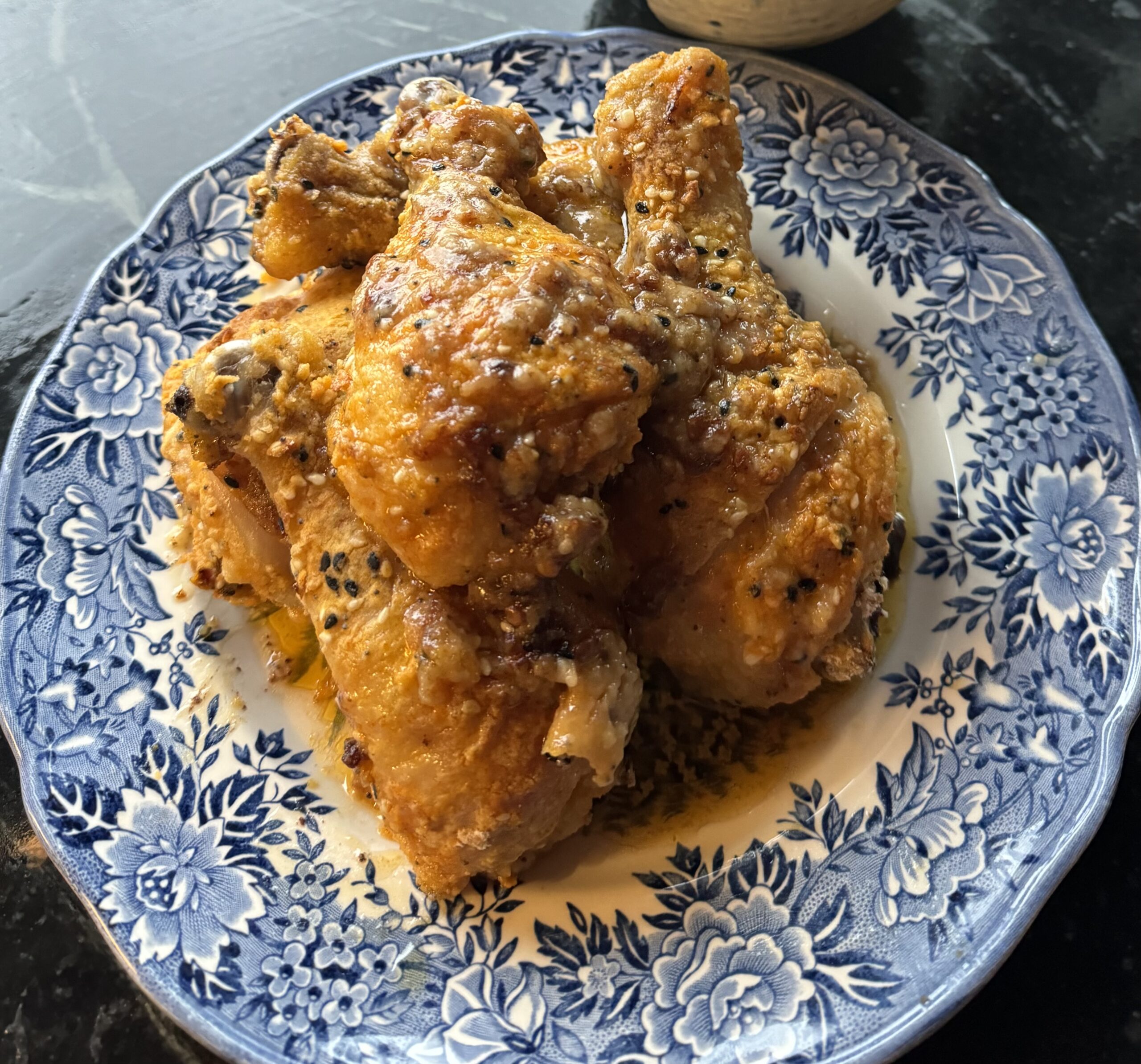 a plate full of crispy chicken legs
