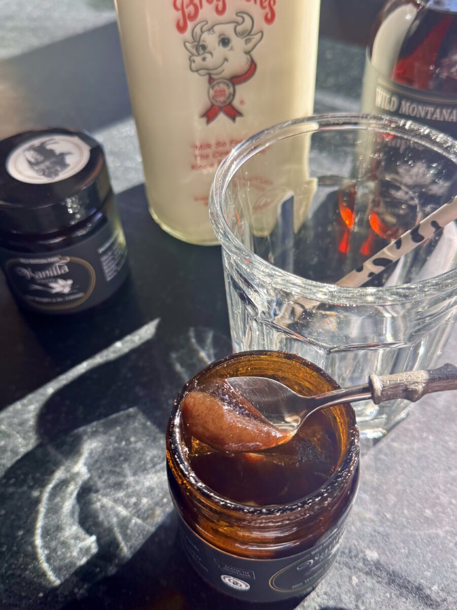 a spoon filled with vanilla bean paste