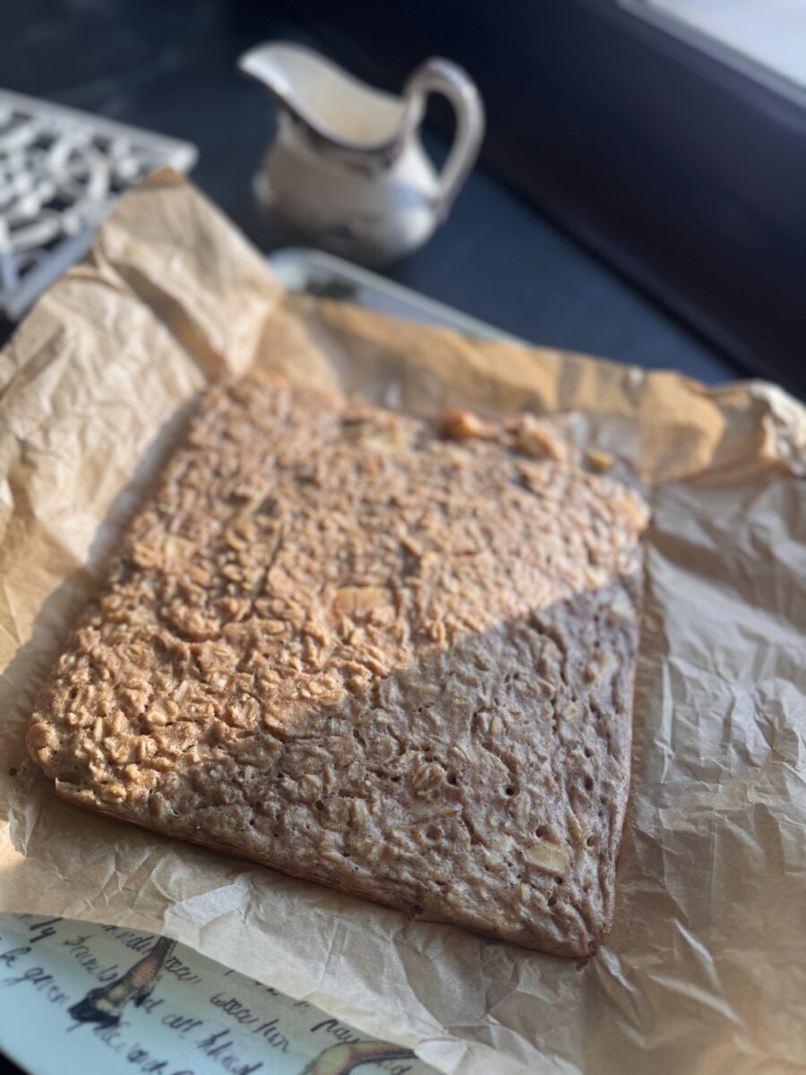 overnight oats removed from pan to cool on a piece of parchment paper 